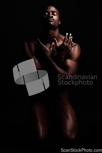Image of Nude, naked body and strong black man for art deco in dark studio with muscle power and strength. Sport person or bodybuilder model for motivation, health and wellness for erotic fitness background