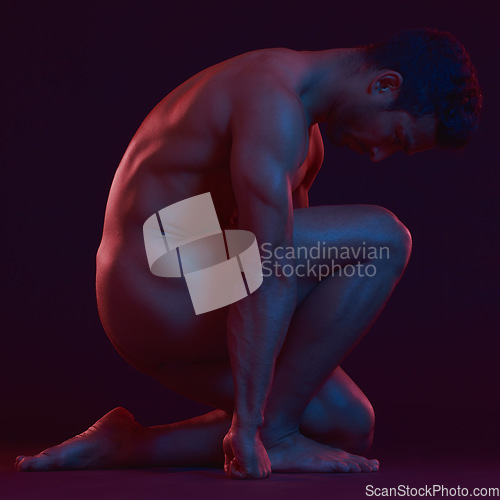 Image of Nude, strong and freedom with a model asian man in studio on a dark background for artistic body positivity. Skin, natural and art with a handsome young male posing naked on a black backdrop
