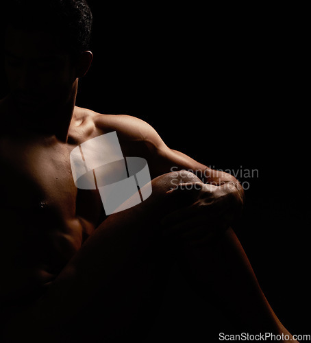 Image of Nude, artistic and freedom with a model asian man in studio on a dark background for art or body positivity. Skin, natural and artwork with a handsome young male posing naked on a black backdrop