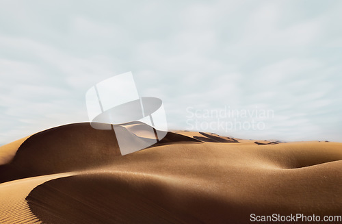 Image of Sand, dessert and nature background in summer looking sexy like the beauty and body of a nude woman lying naked. Blue sky copy space above dry, arid and sandy terrain in the outdoor environment