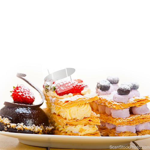 Image of selection of fresh cream cake dessert plate