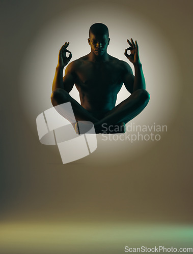 Image of Meditation shadow, float or relax man meditate in spiritual mental health, chakra energy balance or soul aura healing. Zen mindset peace, mindfulness or model silhouette isolated on studio background