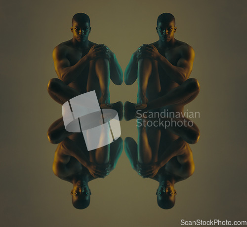 Image of Art, reflection and body portrait of black man sitting naked on studio background. Fashion, skin and beauty, serious nude male model in multiple creative pose reflected on dark mirror floor with neon