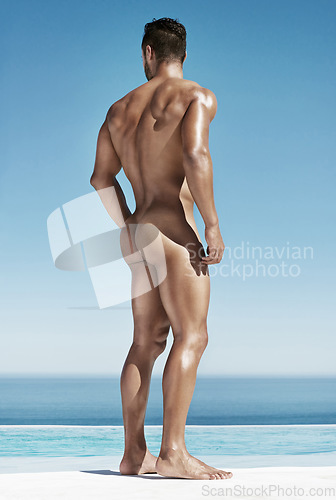 Image of Man, naked butt and muscle by swimming pool for sunshine, relax or vacation by ocean. Bodybuilder, model and glow on skin in summer with strong body, beauty or ass on tropical sea holiday in Thailand