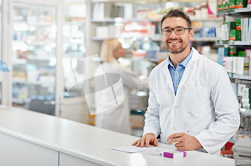 Image of Portrait of happy pharmacist man with pharmacy services, medicine advice and product trust at shop, retail counter. Inventory, stock help desk and medical professional worker, person or doctor smile