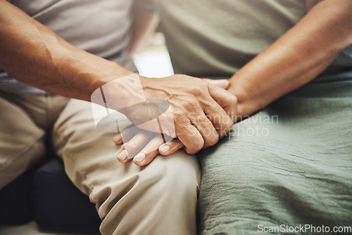 Image of Hand holding, elderly couple and hands with love, care and peace feeling support and solidarity. Home, relax and loving gesture of an old man with woman in retirement and senior marriage at a house