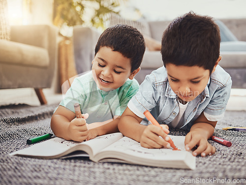 Image of Children, learning and brothers drawing on a floor in their home, relax and happy while bonding. Kids, art and sketch in notebook by siblings having fun in living room, smile and enjoying brotherhood