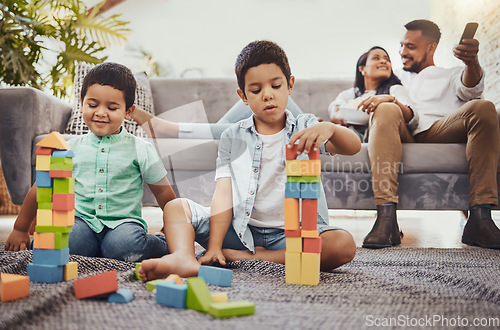 Image of Family, toys and living room floor fun of children doing a learning knowledge development activity. Watching tv, parents and kids at home with love and care together building blocks for education