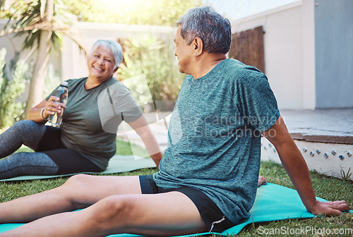 Image of Yoga, fitness and senior couple in garden with exercise, cardio and workout together on grass for retirement health. Water bottle, nutrition and healthy elderly people or friends in backyard pilates