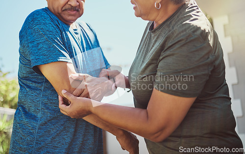 Image of Senior, man arm injury and woman helping husband after exercise, fitness and workout accident. Elderly, arthritis and joint pain with a couple in retirement outdoor for health and wellness activity