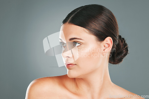 Image of Woman, beauty and face in studio for skincare, wellness and facial cosmetics. Young female model, headshot and aesthetic makeup for dermatology, healthy shine and natural glow from body salon results