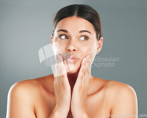 Image of Skincare, beauty and shocked woman in a studio for a health, wellness and natural face routine. Cosmetic, surprise and female model with a healthy facial treatment isolated by a gray background.