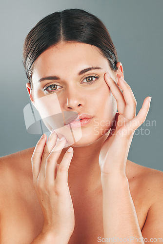 Image of Skincare, beauty wellness and portrait of woman on gray background for cosmetics, facial treatment and spa. Dermatology, aesthetic and face of girl with glowing, healthy and natural skin in studio