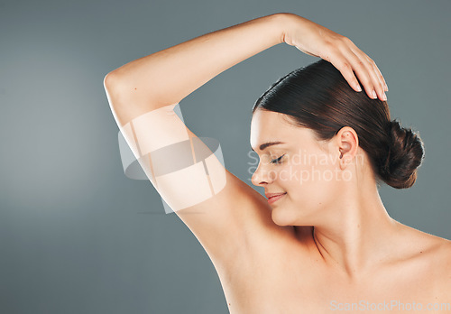 Image of Cleaning, armpit and woman with wellness, health and body smell of a model with studio mockup. Isolated, young female and person with skincare, hygiene and deodorant fragrance underarm with sweat