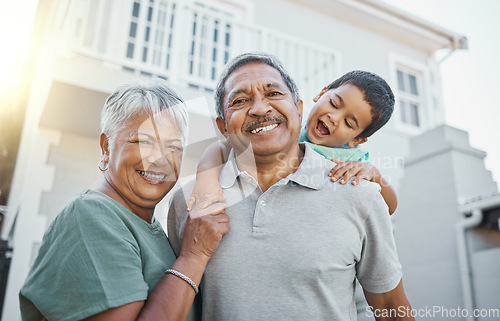 Image of Portrait, piggyback and happy grandparents with a child in the backyard of their family home. Happiness, smile and elderly man and woman in retirement bonding with their grandson outdoor their house.