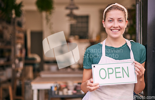 Image of Woman, pottery and small business with open sign for creative startup, welcome or entrepreneurship at retail store. Portrait of happy shop owner with smile by entrance ready for service at the door
