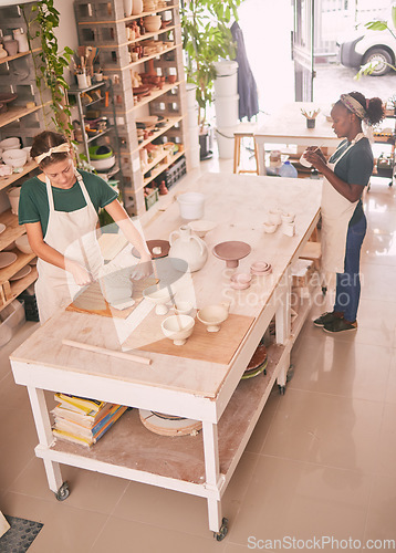 Image of Pottery business and workshop people sculpting together for creative process and productivity with tools top view. Focus, concentration and skill of interracial artist team in workspace.