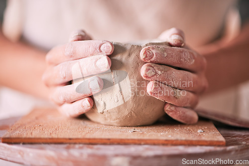 Image of Creative, pottery and design with hands of woman in workshop studio for mold, ceramics and art. Clay, sculpture and manufacturing with girl artisan on table for crafting, handmade and hobby