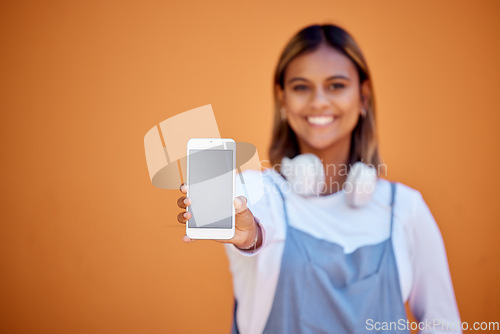 Image of Portrait, mockup and woman with smartphone, smile and screen with girl on brown studio background. Face, female and girl with cellphone, space or connection for social media, chatting and on backdrop