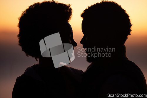 Image of Sunset, love and silhouette of black couple in nature for romance, bonding and happiness. Sunrise, travel and summer break with man and woman hugging for affection, passion and smile on vacation