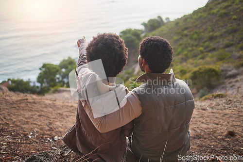 Image of Relax, ocean and hiking with black couple on mountain for adventure, nature and sunrise. Peace, discovery and expedition with man and woman hiker on path for trekking, freedom and travel vacation