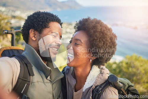 Image of Love, nature and selfie, couple hiking on mountain for fitness, fun and romantic walk in natural landscape. Romance, hiker man and black woman talking self portrait with smile in mountains on island.