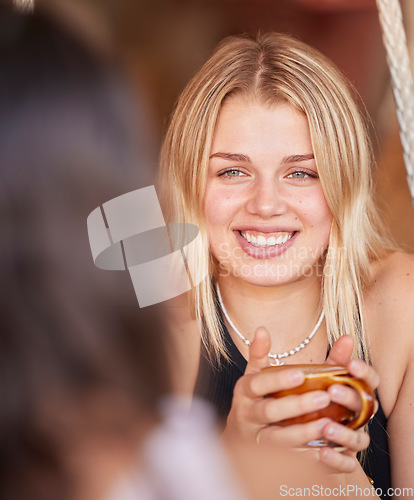 Image of Woman, friends and smile for coffee, conversation or chatting about social life or gossip at an outdoor cafe. Happy female smiling in happiness for warm beverage, discussion or talking to best friend