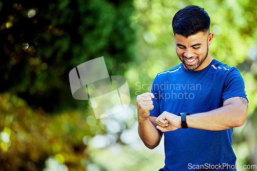 Image of Fitness, mockup and watch with a man cheering his progress as a runner on a cardio or endurance workout. Exercise, running and health with a male athlete celebrating a target or goal while training