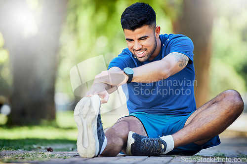 Image of Exercise, man on ground and stretching legs, workout and training for fitness, warm up and wellness outdoor. Relax, male athlete and runner stretch, sports and performance for endurance and energy