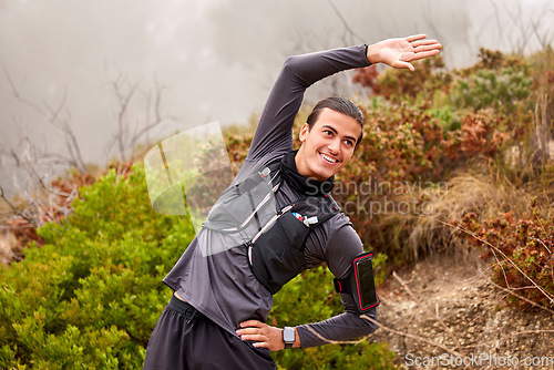 Image of Stretching, fitness and workout man in nature training, exercise or professional sports, runner and marathon. Happy, healthy and muscle warm up, energy of athlete hiking, cardio or wellness in forest