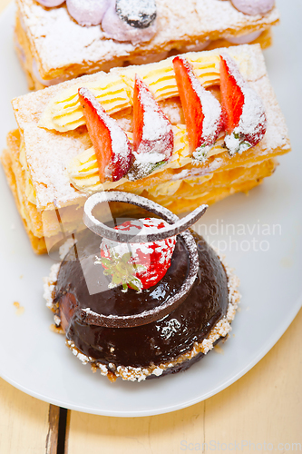 Image of selection of fresh cream cake dessert plate