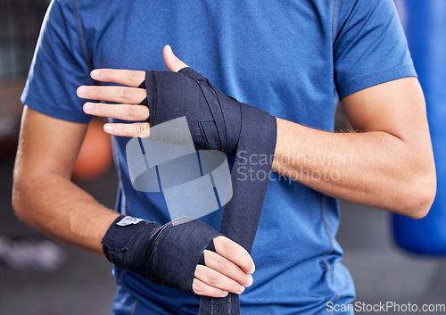 Image of Fitness, boxing and tape with hands of man in gym for sport, workout and martial arts training. Exercise, strong and wellness with boxer and wrap bandage in mma class for fight, health or performance