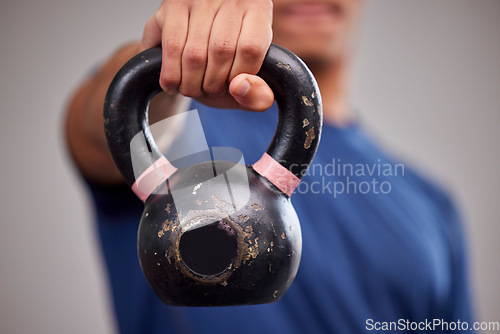 Image of Fitness, kettlebell and man athlete in a gym for a arm muscle workout or sport training. Sports, weights and healthy male bodybuilder doing a strength exercise in a gymnasium or wellness studio.