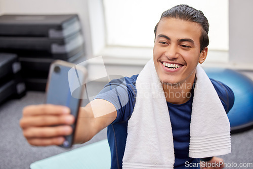 Image of Fitness, man and smile for selfie, social media or profile picture with towel after workout exercise or training at the gym. Happy sporty male vlogger or influencer smiling in happiness for vlog post