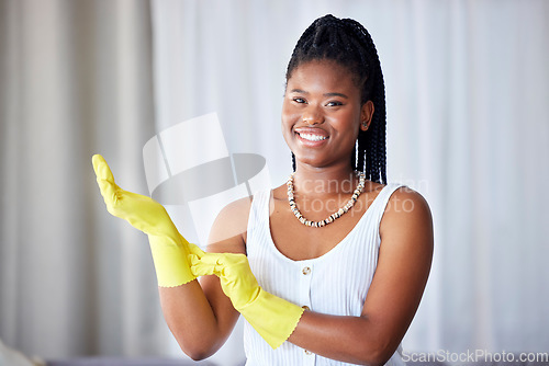 Image of Cleaning, black woman and cleaner gloves portrait of a girl happy about home health care. House maintenance, smiling main and happiness from housekeeper service employee ready for housework chores