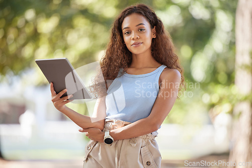 Image of Youth, woman and portrait in park with tablet for research, studying or online streaming. Assertive and confident college girl with digital device for student leisure in nature with bokeh.