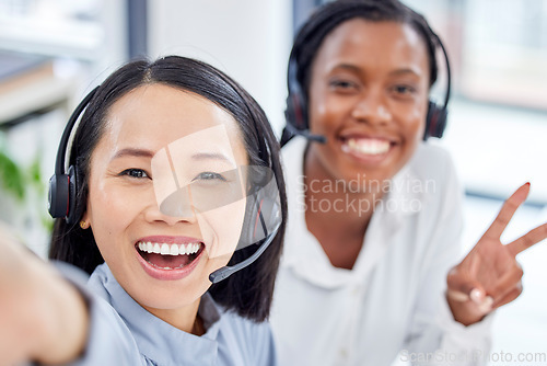 Image of Call center woman, selfie and teamwork with friends, diversity and happiness in crm workplace. Customer support agent team, consultant ground and peace with women, african and asian with solidarity