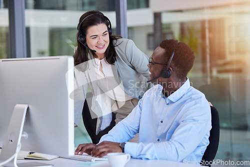 Image of Call center, customer service and a manager talking to a black man consultant in their telemarketing office. Ecommerce, contact us and training with a female supervisor coaching a male sales employee