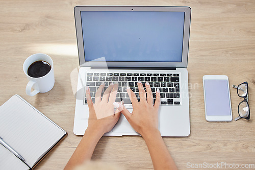 Image of Hands, laptop and typing on mockup screen for digital marketing, branding or advertising on wooden desk. Hand of event planner, blogger or designer above on computer for social media or advertisement