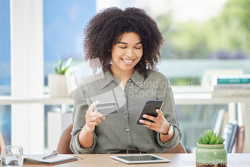 Image of Phone, credit card and online shopping with a business black woman buying a product online in her office. Ecommerce, finance and retail with a female employee or customer making an internet payment