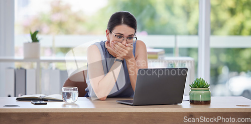 Image of Surprise, mistake or error with a business woman looking shocked while working on a laptop in her office. Computer, glitch and problem with a scared female employee worried about a system failure