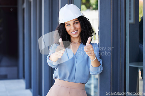 Image of Black woman, portrait smile and thumbs up for construction, building or good job with hard hat for on site work safety. Happy African American female architect, engineer or builder showing thumbsup