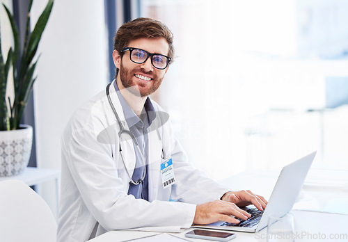 Image of Doctor, research and healthcare portrait with online service, telehealth advice and mission for hospital management. Clinic or medical professional man or person typing on laptop for virtual support