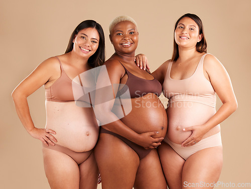 Image of Portrait, beauty and tummy with pregnant friends in studio on a beige background for diversity or motherhood. Family, love and pregnancy with a woman friend group showing their baby bump stomach