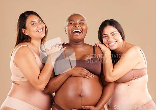 Image of Portrait, beauty and body with pregnant friends in studio on a beige background for diversity or motherhood. Family, love and pregnancy with a woman friend group showing their baby bump stomach