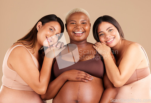 Image of Portrait, beauty and happy with pregnant friends in studio on a beige background for diversity or motherhood. Family, love and pregnancy with a woman friend group showing their baby bump stomach