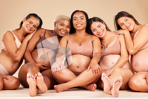 Image of Pregnant woman group, studio portrait and support for happiness, diversity or smile for solidarity by background. Friends, pregnancy and happy with excited face, future or sitting for hug by backdrop