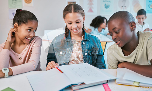 Image of Friends, education and children in happy class work together on project in Montessori school. Books, help and diversity, group of students with math test question, brainstorming and thinking at desk.