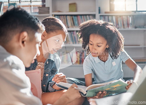 Image of Education, storytelling or students reading in a library for group learning development or growth. Diversity, kids or children talking or speaking together for feedback on fun fantasy books at school