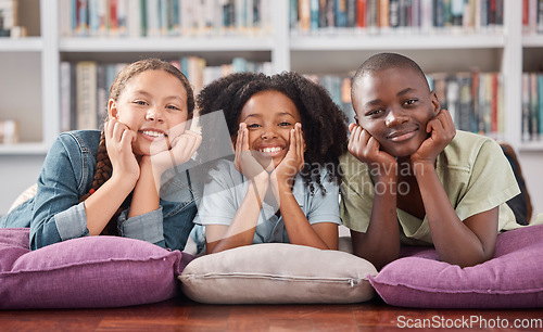 Image of Children in library, portrait with learning and education, happy with books and academic growth. Knowledge, information and development with young students, happiness to learn and school activity